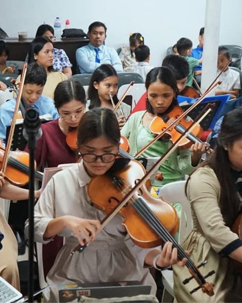 The mini orchestra playing during a service